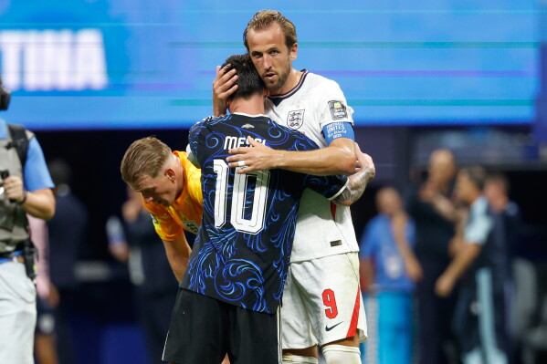 Argentina's Lionel Messi (10) and England's Harry Kane (9) embrace after the World Cup semifinal soccer match between England and Argentina in Atlanta, Wednesday, July 15, 2026. (AP Photo/Erik S. Lesser)
