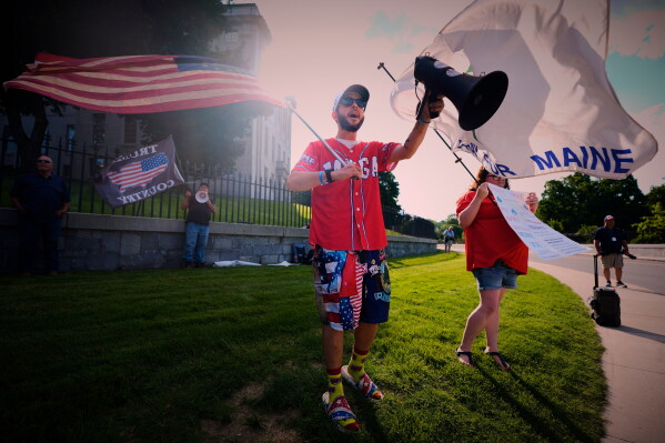 Nick Blanchard leads a small rally in support of U.S. Immigration and Customs Enforcement, outside the State House in Augusta, Maine, Wednesday July 15, 2026. (AP Photo/Robert F. Bukaty)
