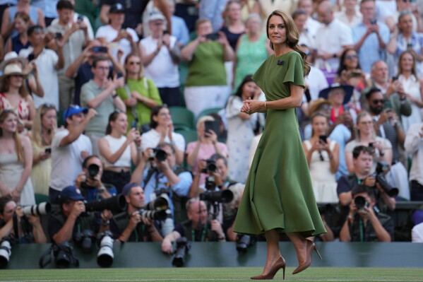 Britain's Kate Princess of Wales walks from Center Court after presenting the trophies for the men's singles final at Wimbledon Tennis Championships in London, Sunday, July 12, 2026. (AP Photo/Kin Cheung)