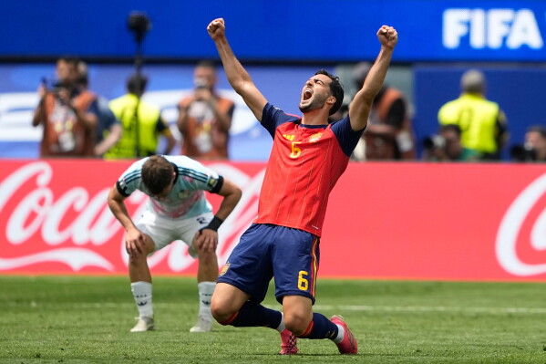 Spain's Mikel Merino (6) celebrates after their win in the World Cup quarterfinal soccer match between Spain and Belgium in Inglewood, Calif., near Los Angeles, Friday, July 10, 2026. (AP Photo/Lindsey Wasson)