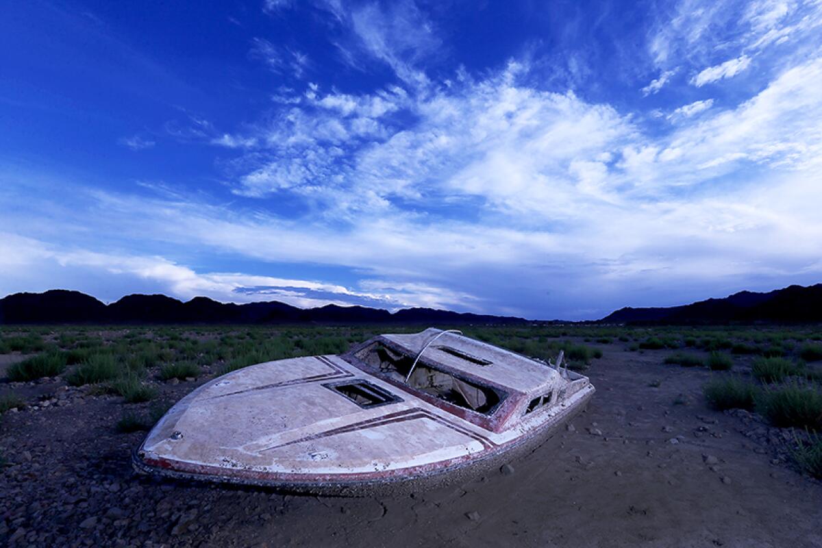 A 2022 photo of a boat exposed by dropping water levels at Lake Mead. 
