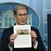 US Secretary of Treasury Scott Bessent shows a proposed $250 bill featuring President Donald Trump during a press briefing in the Brady Briefing Room of the White House in Washington, DC.