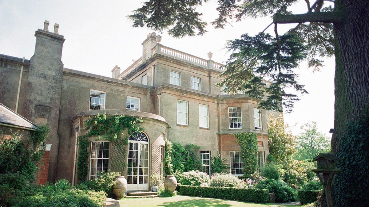 Prince Charles stands outside Highgrove House during an interview.