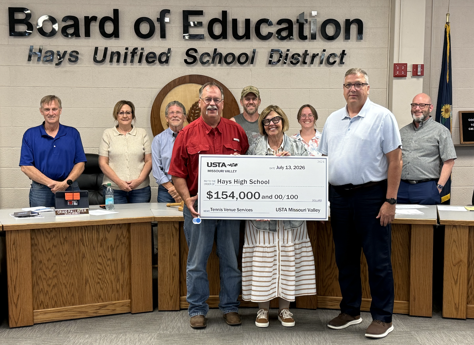 The Hays USD 489 school district was presented with checks from executive director for Missouri Valley (United States Tennis Association). $14,000 from Missouri Valley USTA and $140,000 from USTA for the construction of four new tennis courts at the Hays High School and Hays Middle School campus that were completed in April. The check was presented at the Hays school board meeting on July 13.