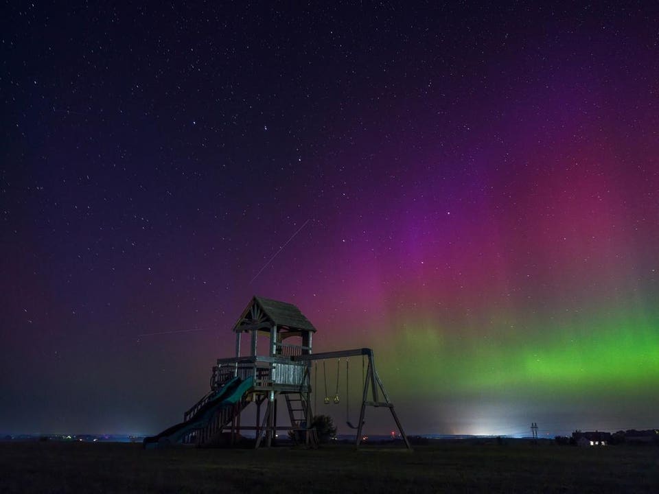 The aurora borealis glows in shades of green, pink, and purple above farmland during a rare appearance in rural southern Wisconsin in Monroe, Wisconsin, USA, on September 14, 2025. The northern lights could become visible across parts of the northern U.S. overnight on Thursday, July 23 and Friday, July 24, as two coronal mass ejections travel towards Earth from the sun. (Photo by Ross Harried/NurPhoto via Getty Images)