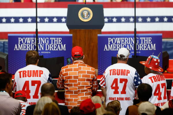 Supporters stand ready for President Donald Trump to arrive to speak at Wheeler High School in Marietta, Ga., Wednesday, July 22, 2026. (AP Photo/Erik S. Lesser)