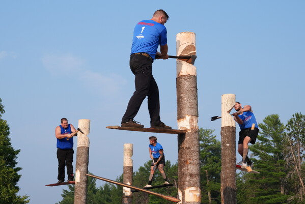 The final springboard chop event is underway during the Lumberjack World Championships, Saturday, July 18, 2026, in Hayward, Wis. (AP Photo/Ellen Schmidt)