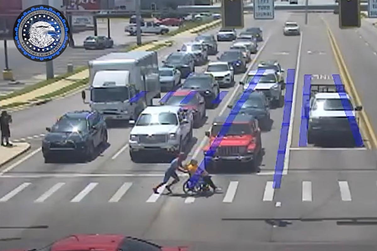 ‘Spider-Man’ superhero, 20, saves the day helping man in wheelchair pass six lanes of traffic