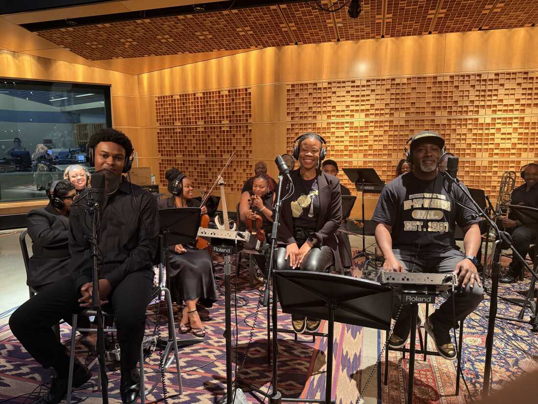 Kaleb Cabell, Andrea Coln McNeill and Jeffrey McNeill perform as part of The Illharmonic Orchestra at NPR's headquarters in Washington, D.C.