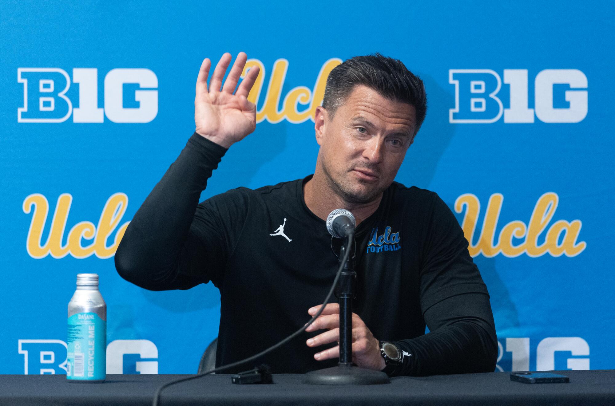 UCLA coach Bob Chesney speaks with reporters after the spring game.