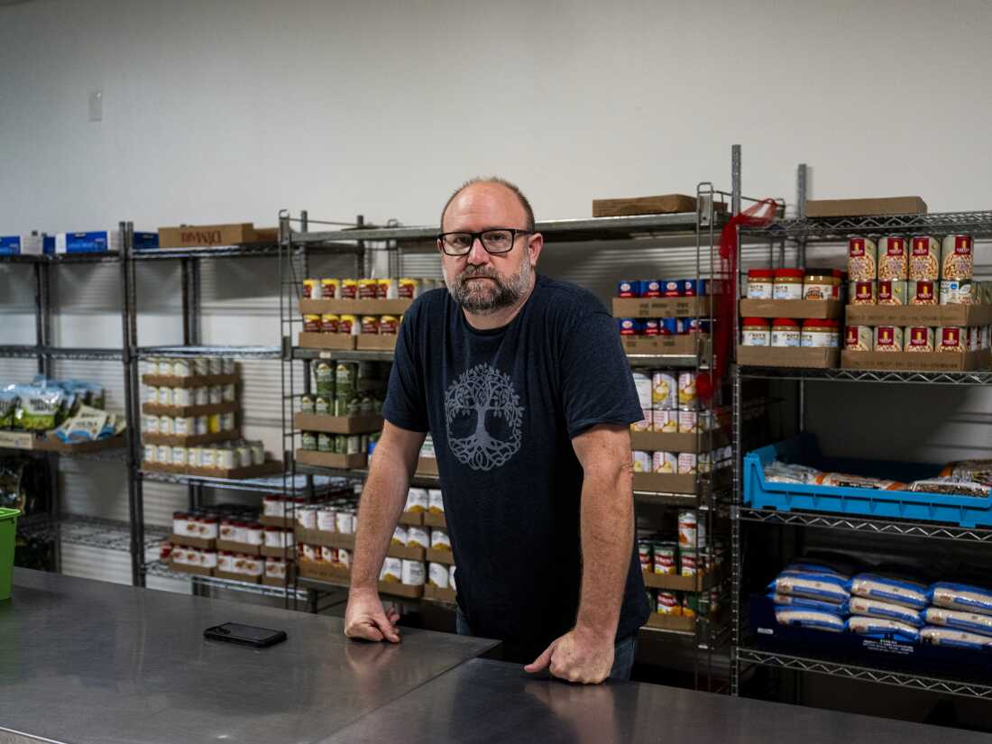 Hunter Demster, a community organizer and co-founder of Vecindarios901, inside of a food pantry in First Congregational Church.