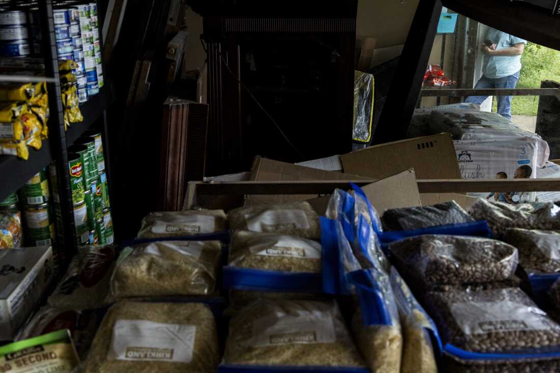 A volunteer delivery person is seen at Amber Hampton’s garage in a suburb of Memphis where Hampton runs one of the many “immigrant pantries” in the Memphis area.