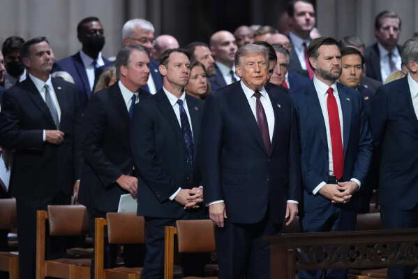 President Donald Trump, Vice President JD Vance and other guests attend the funeral of Sen. Lindsey Graham, R-S.C., Tuesday July 28, 2026, at the Washington National Cathedral in Washington. (AP Photo/Jacquelyn Martin)