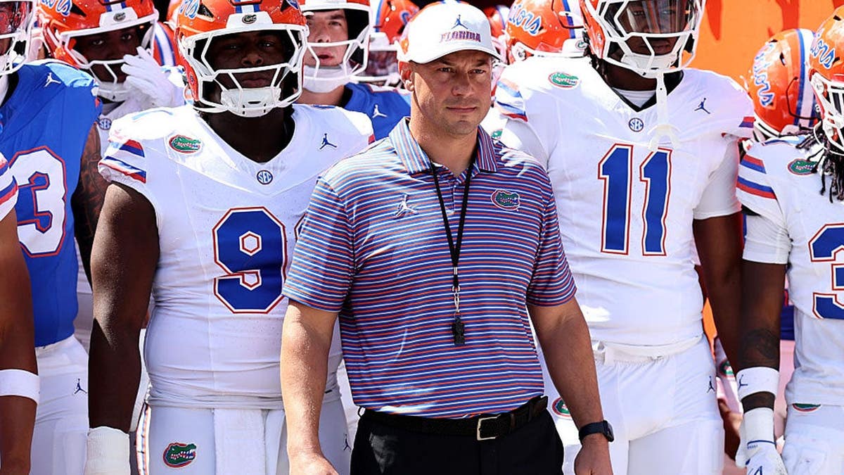 Jon Sumrall waits before taking the field at Ben Hill Griffin Stadium.