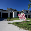 A 'for sale' sign in front of a home in Florida.