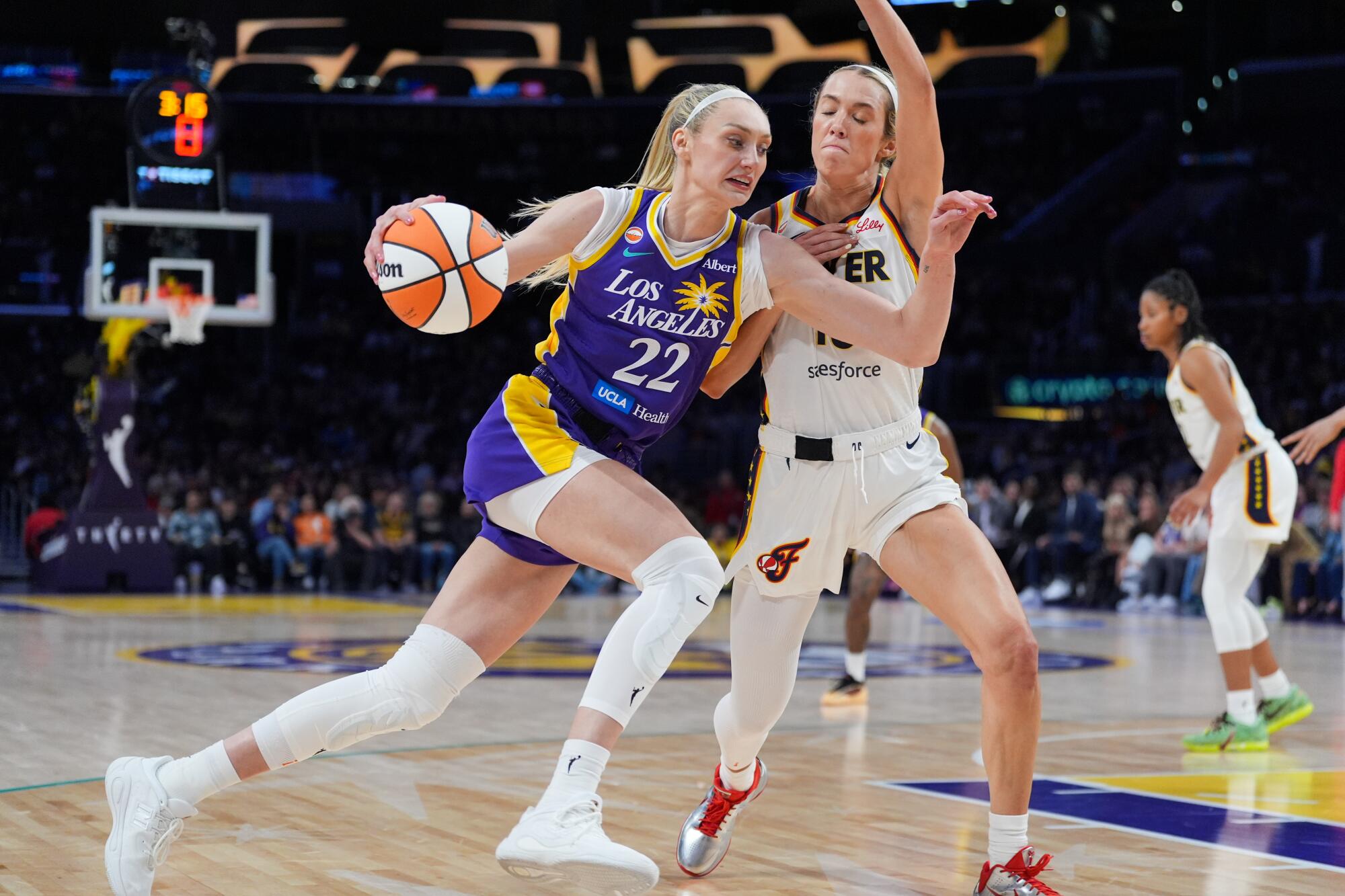 Cameron Brink is pressured by Indiana Fever guard Lexie Hull during a game in May.