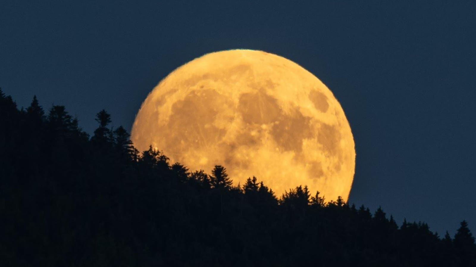 In Photos: Full ‘Buck Moon’ Rises To Set Up A Total Solar Eclipse