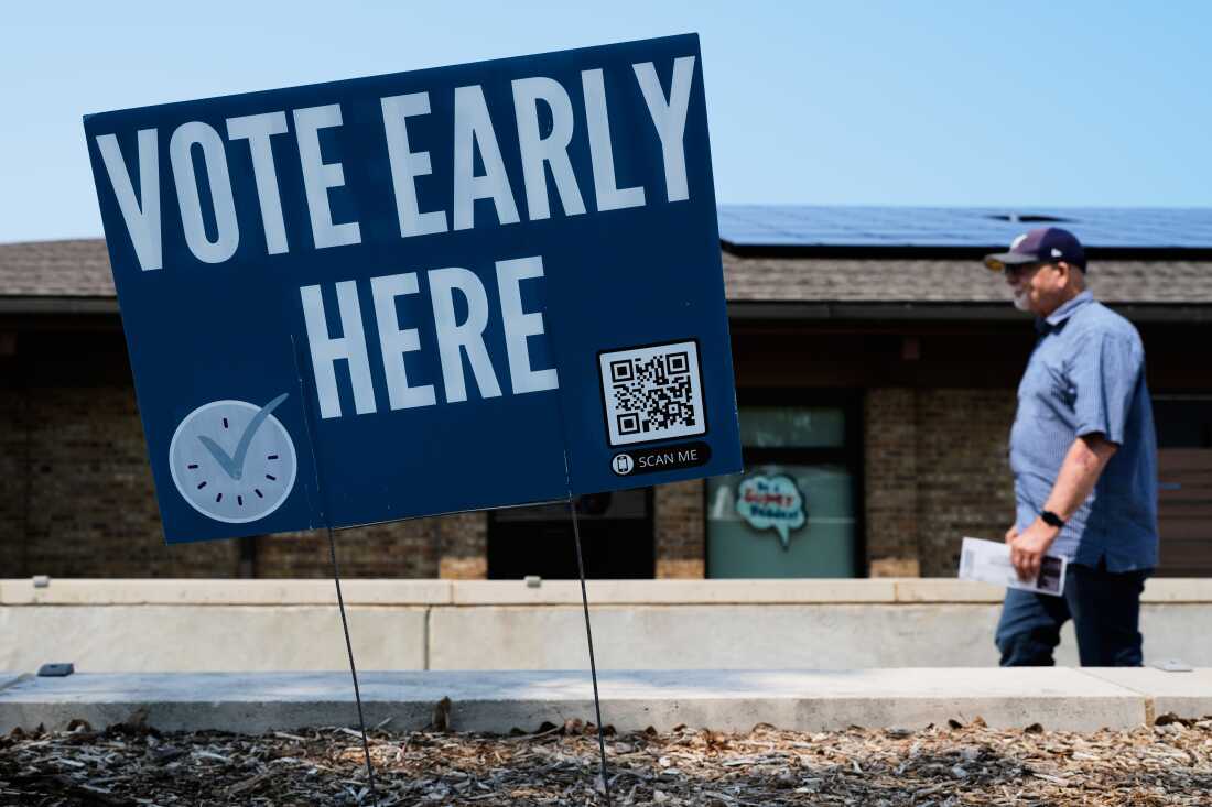 A voter walks to polling place in Milwaukee on July 28.