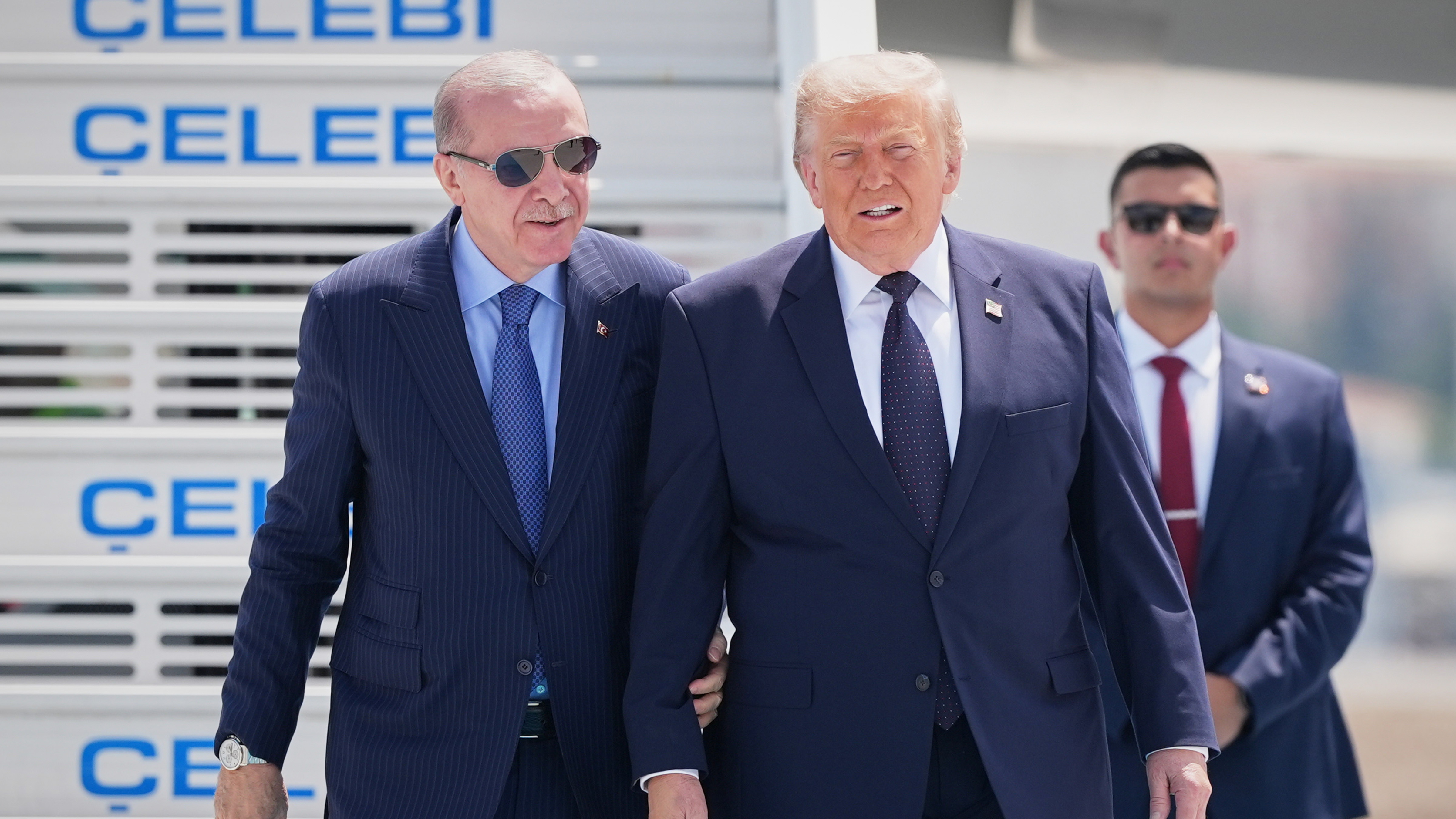 President Donald Trump walks with Turkish President Recep Tayyip Erdogan, left, upon arriving for the NATO summit in Ankara, Turkey, Tuesday, July 7, 2026.