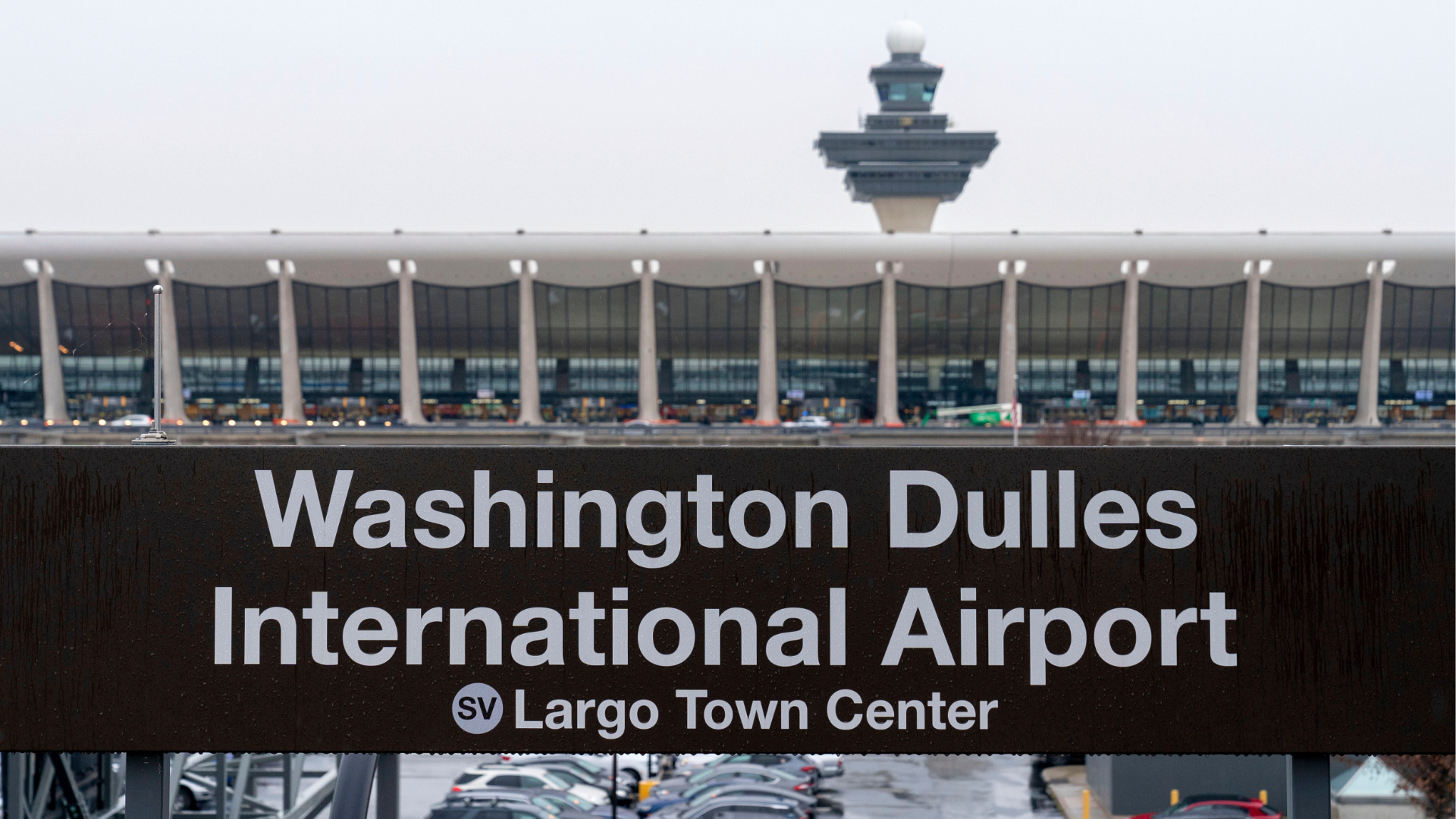 FILE - A sign of Washington Dulles International Airport station is seen at Washington Dulles International Airport, in Chantilly, Va., Nov. 15, 2022.
