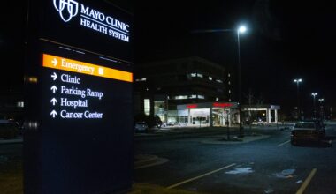 Street lights shine on the Mayo Clinic parking lot at night
