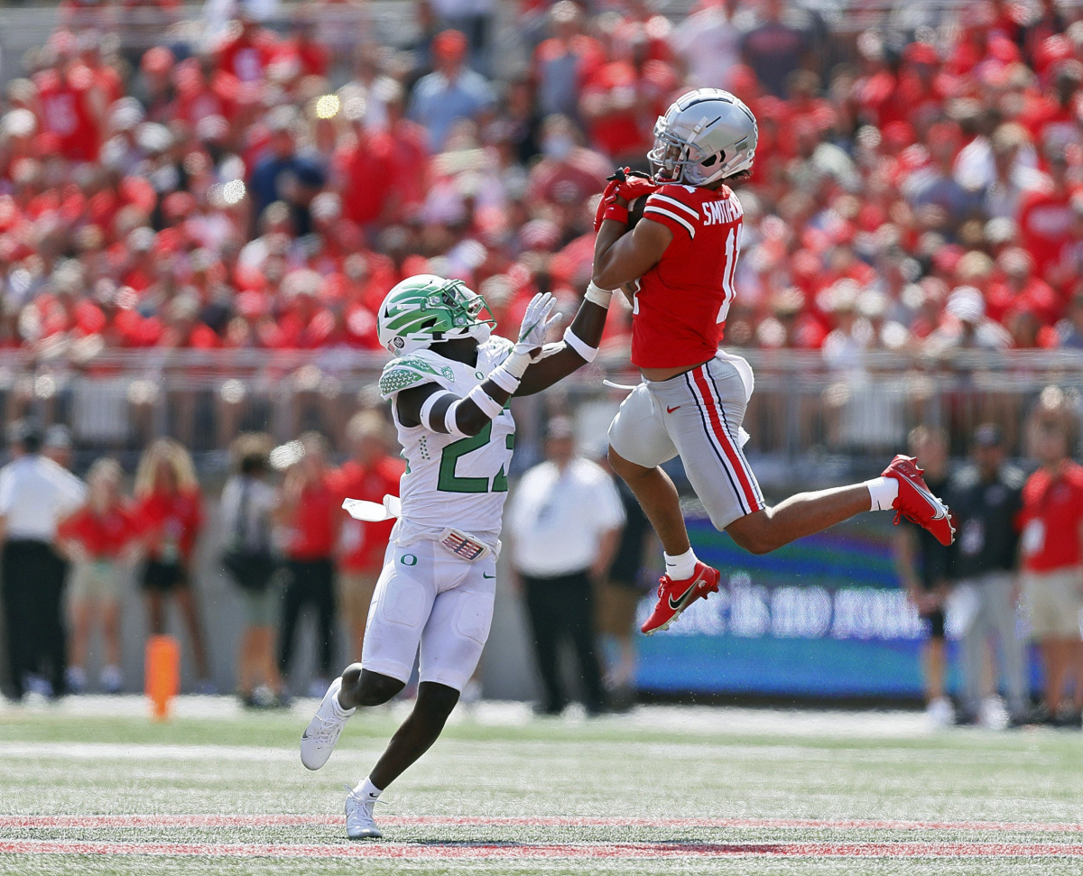 Ohio State Buckeyes wide receiver Jaxon Smith-Njigba (11) comes up with the catch against Oregon Ducks safety Verone McKinley III (23) during the third quarter in their NCAA Division I game on Saturday, September 11, 2021 at Ohio Stadium in Columbus, Ohio. Ohio State Buckeyes wide receiver Jaxon Smith-Njigba (11) comes up with the catch against Oregon Ducks safety Verone McKinley III (23) during the third quarter in their NCAA Division I game on Saturday, September 11, 2021 at Ohio Stadium in Columbus, Ohio.