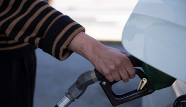 A person pumps their gasoline at a gas station in Atlanta, Georgia
