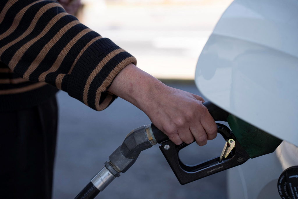 A person pumps their gasoline at a gas station in Atlanta, Georgia