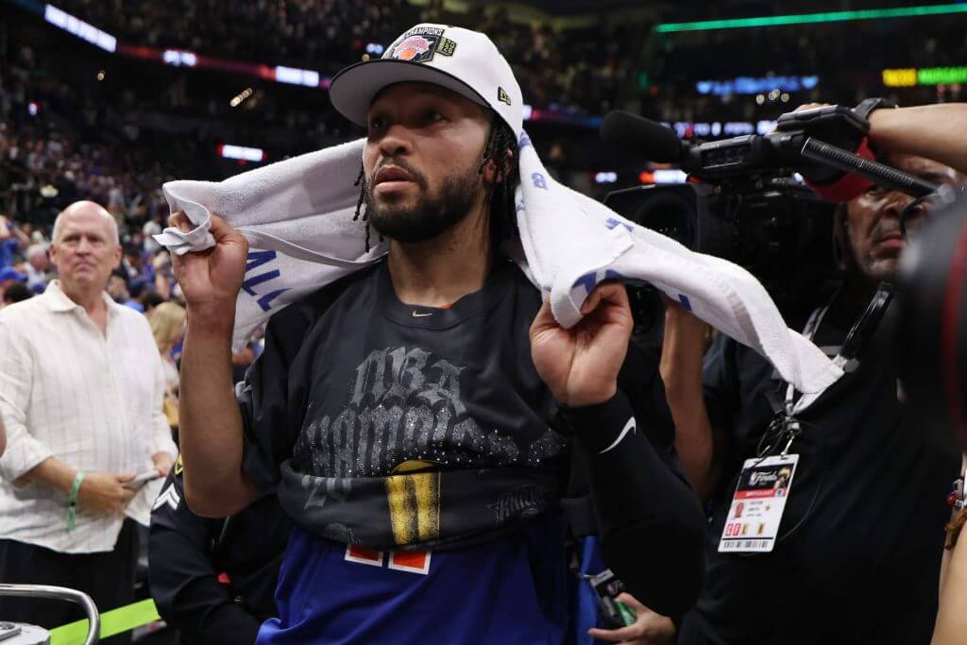 Knicks guard Jalen Brunson stands at the end of the court prior to the championship trophy celebration.