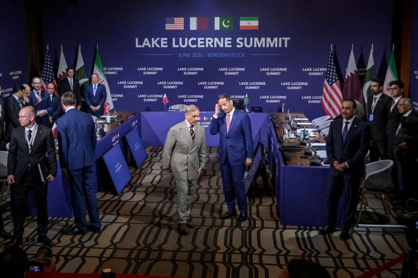 Pakistan's Prime Minister Shehbaz Sharif and Qatar's Prime Minister Sheikh Mohammed bin Abdulrahman bin Jassim al-Thani, center, walk to their spots prior to a quadrilateral meeting between the United States, Iran and their countries at the Burgenstock luxury hotel complex overlooking Lake Lucerne, Switzerland, on June 21.