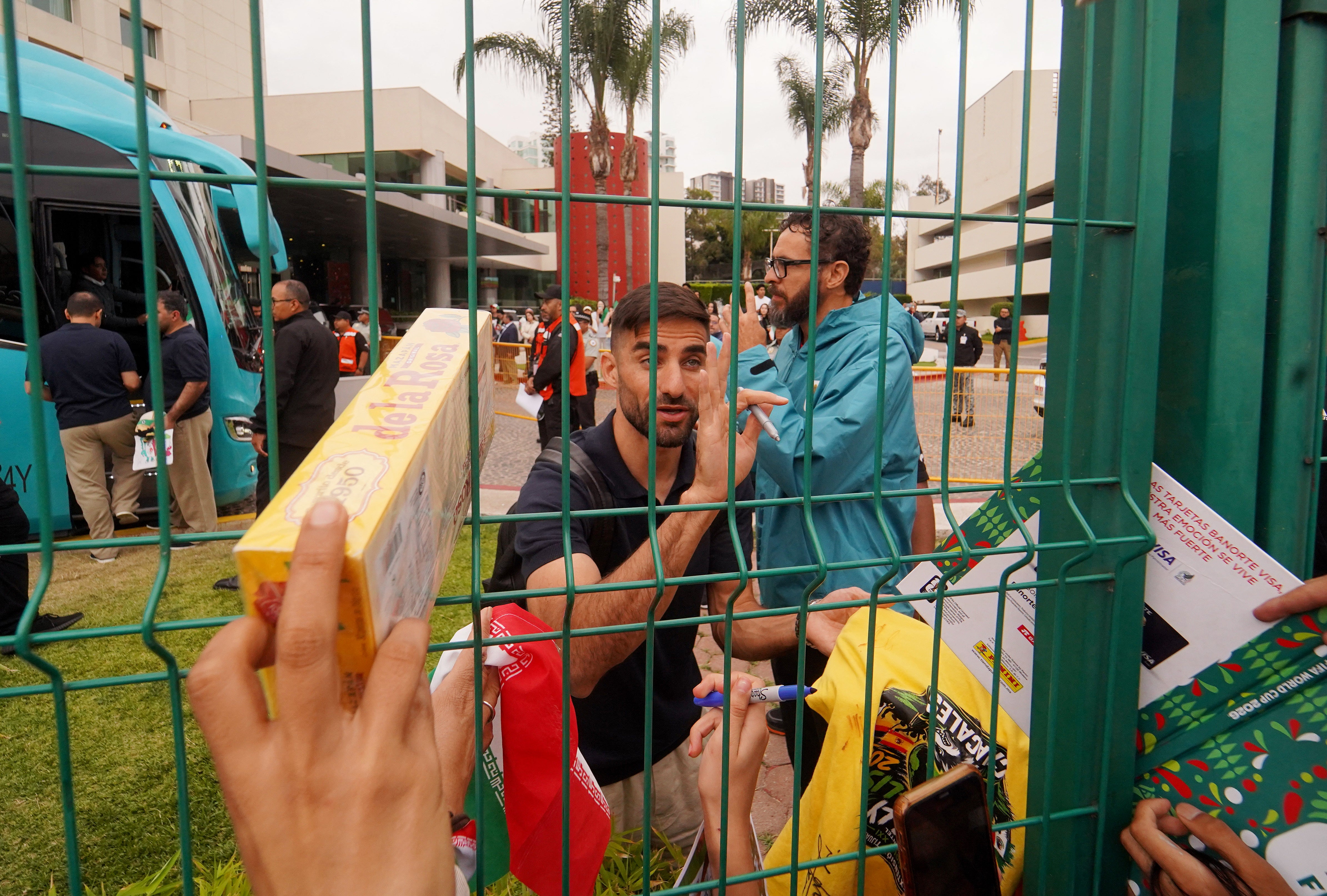Iran's Milad Mohammadi signs autographs for fans