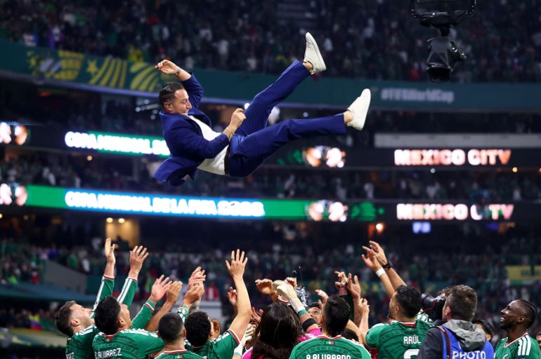 Soccer Football - FIFA World Cup 2026 - Round of 32 - Mexico v Ecuador - Estadio Azteca, Mexico City, Mexico - June 30, 2026 Former Mexico player Andres Guardado is thrown in the air in celebration by the players after the match as Mexico qualify for the round of 16 stage of the World Cup REUTERS/Eloisa Sanchez