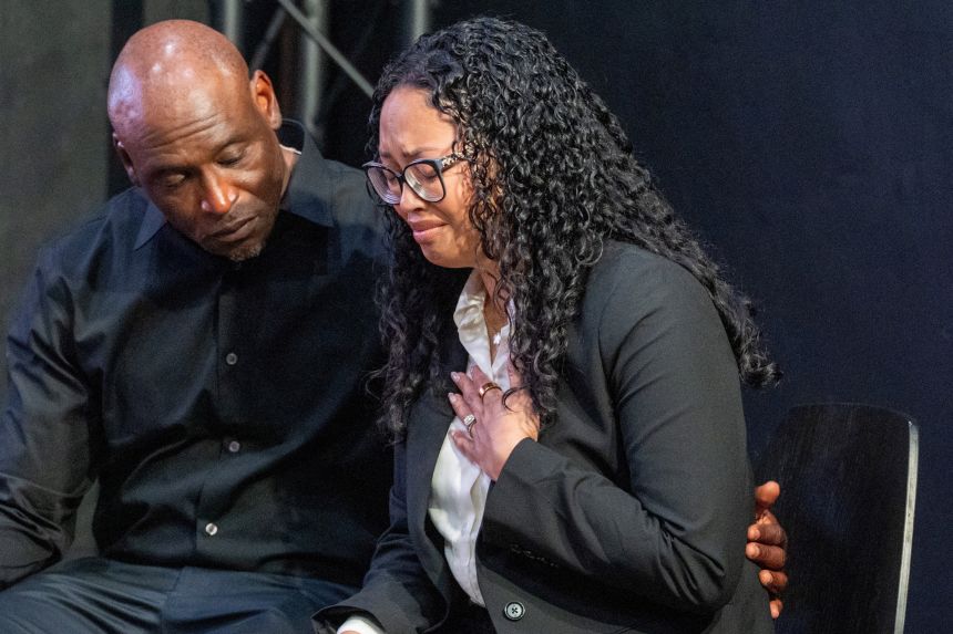 Elmore Wonsley consoles his wife Christine Wonsley during a news conference on July 10, 2026.