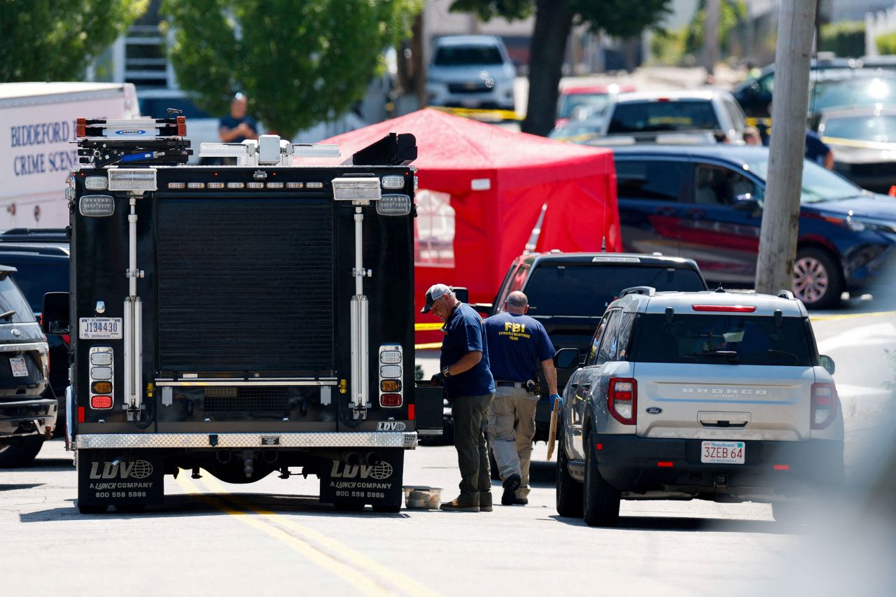 FBI agents work at a scene of a shooting involving US Immigration and Customs Enforcement in Biddeford, Maine, on Monday, July 13.