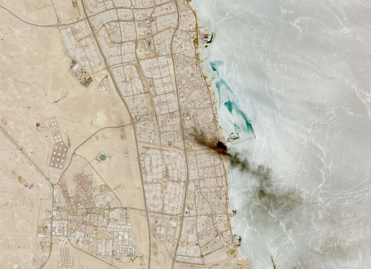 A satellite image shows smoke billowing near an oil facility in Ahmadi Governorate, Kuwait, on Saturday.