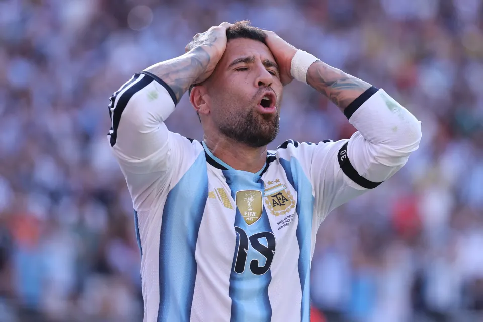Nicolas Otamendi with his hands on his head at the World Cup final