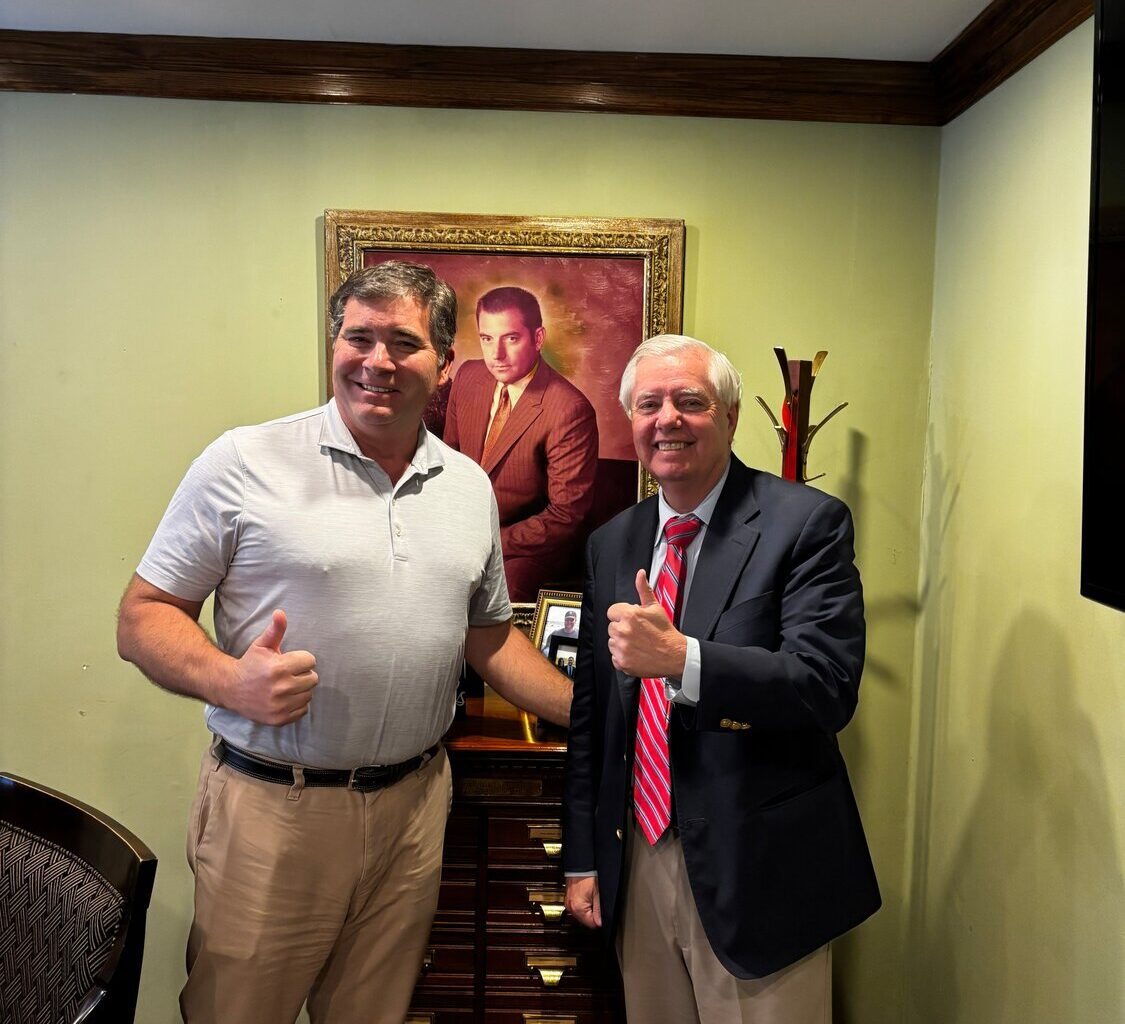 U.S. Sen. Lindsey Graham, right, during a visit to Clinton shortly before his overwhelming win in the Republican primary for re-election.