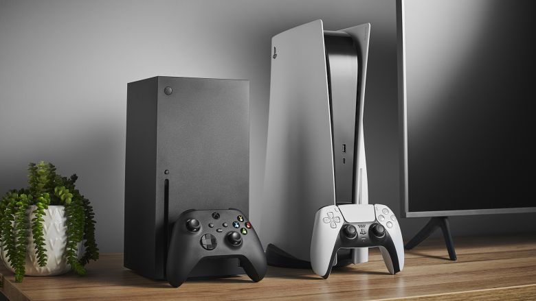 The Microsoft Xbox Series X (L) and Sony PlayStation 5 home video game consoles are shown alongside a television and soundbar on November 3, 2020. (Photo by Phil Barker/Future Publishing via Getty Images)