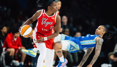 Dallas Wings guard Aziaha James (10) falls against Aces guard Chelsea Gray (12) during a WNBA b ...