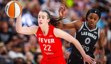 Indiana Fever guard Caitlin Clark (22) dribbles the ball as Aces guard Jackie Young (0) defends ...