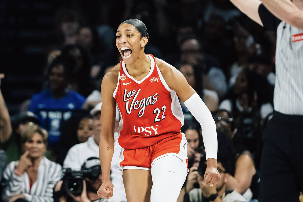 Aces center A'ja Wilson (22) celebrates a successful shot during a WNBA basketball game against ...