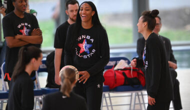 WNBA All-Star A'ja Wilson, center, jokes around during basketball practice in Chicago, Fri ...