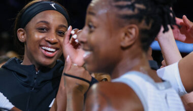 Aces guard Jackie Young (0) grins as her team cheers after beating Portland Fire on Tuesday, Ju ...