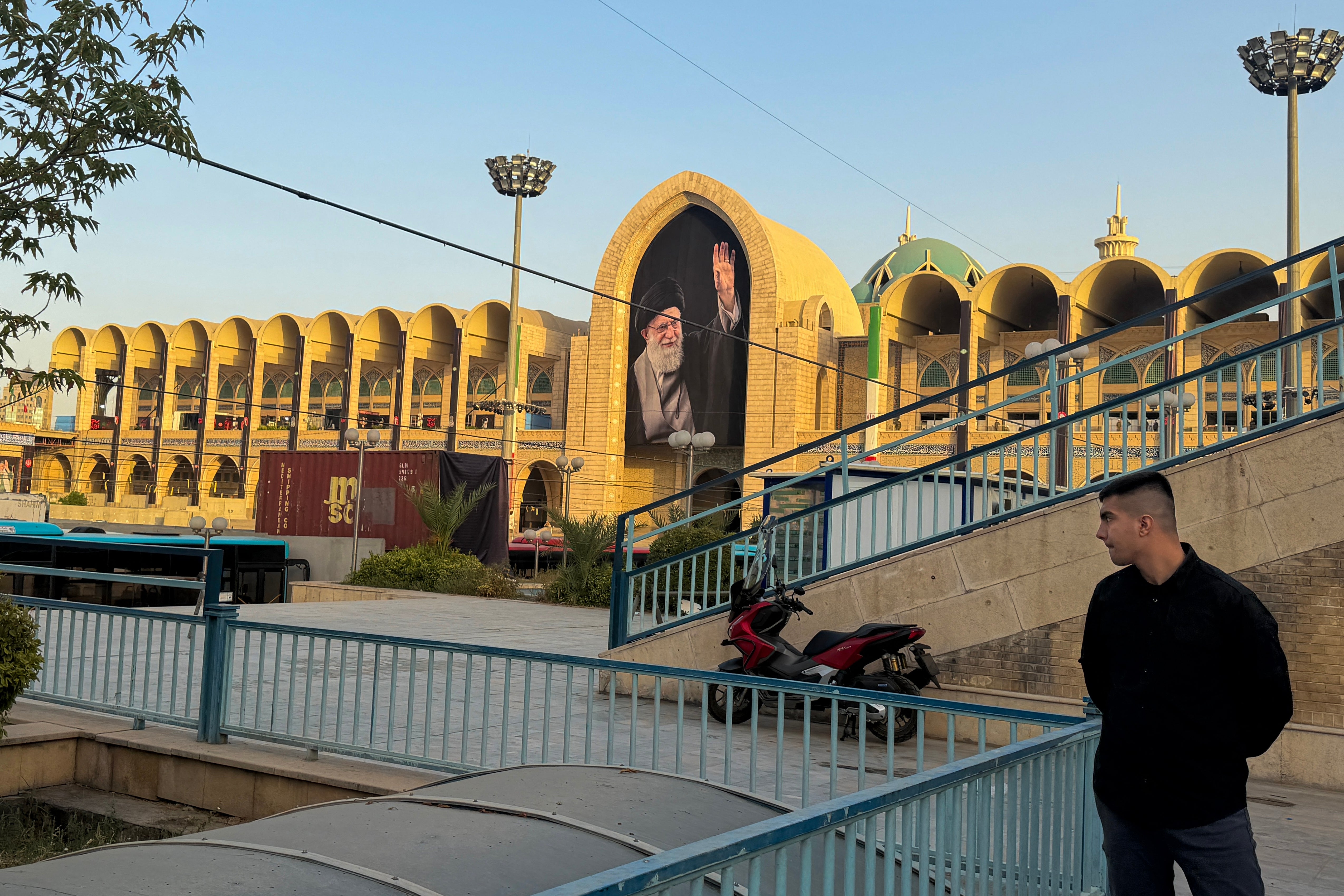 A man stands near the Grand Mosalla in Tehran on July 3, 2026, ahead of Iran's slain supreme leader Ali Khamenei's funeral.