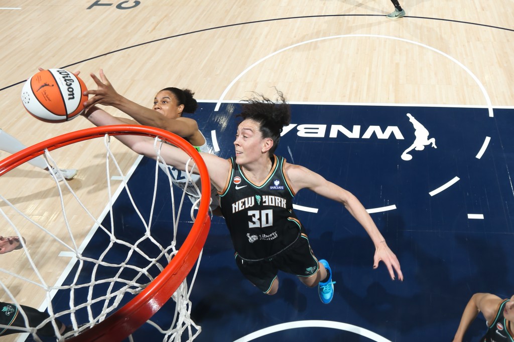 Breanna Stewart #30 of the New York Liberty and Nia Coffey #12 of the Minnesota Lynx go up for the rebound during the game on July 11, 2026 at Target Center in Minneapolis, Minnesota.