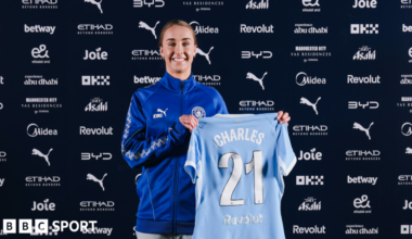 Niamh Charles signing for Manchester City