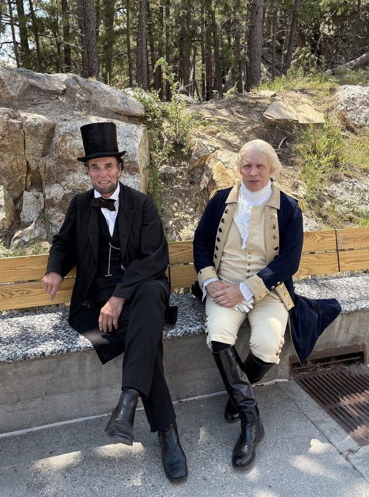Men dressed as Presidents Abraham Lincoln and George Washington 