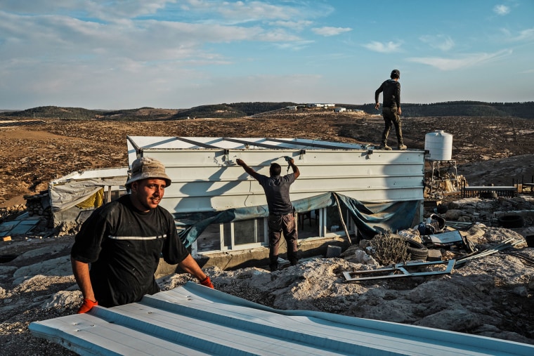 Palestinians from Khirbet Zanuta pack up their belongings and dismantle their homes after a decision was made as a community to leave due to alleged Israeli settler violence and harassment on Oct. 30, 2023. 