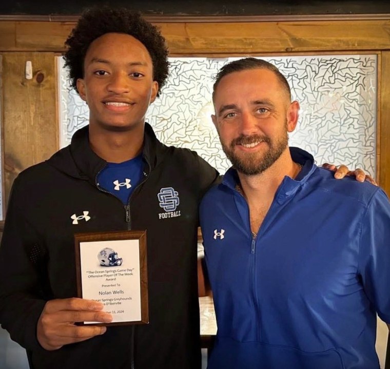 Nolan Wells with his coach, Jake Bramlett.
