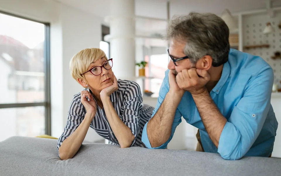 2F64FJD Handsome senior man and attractive old woman are having relationship problems